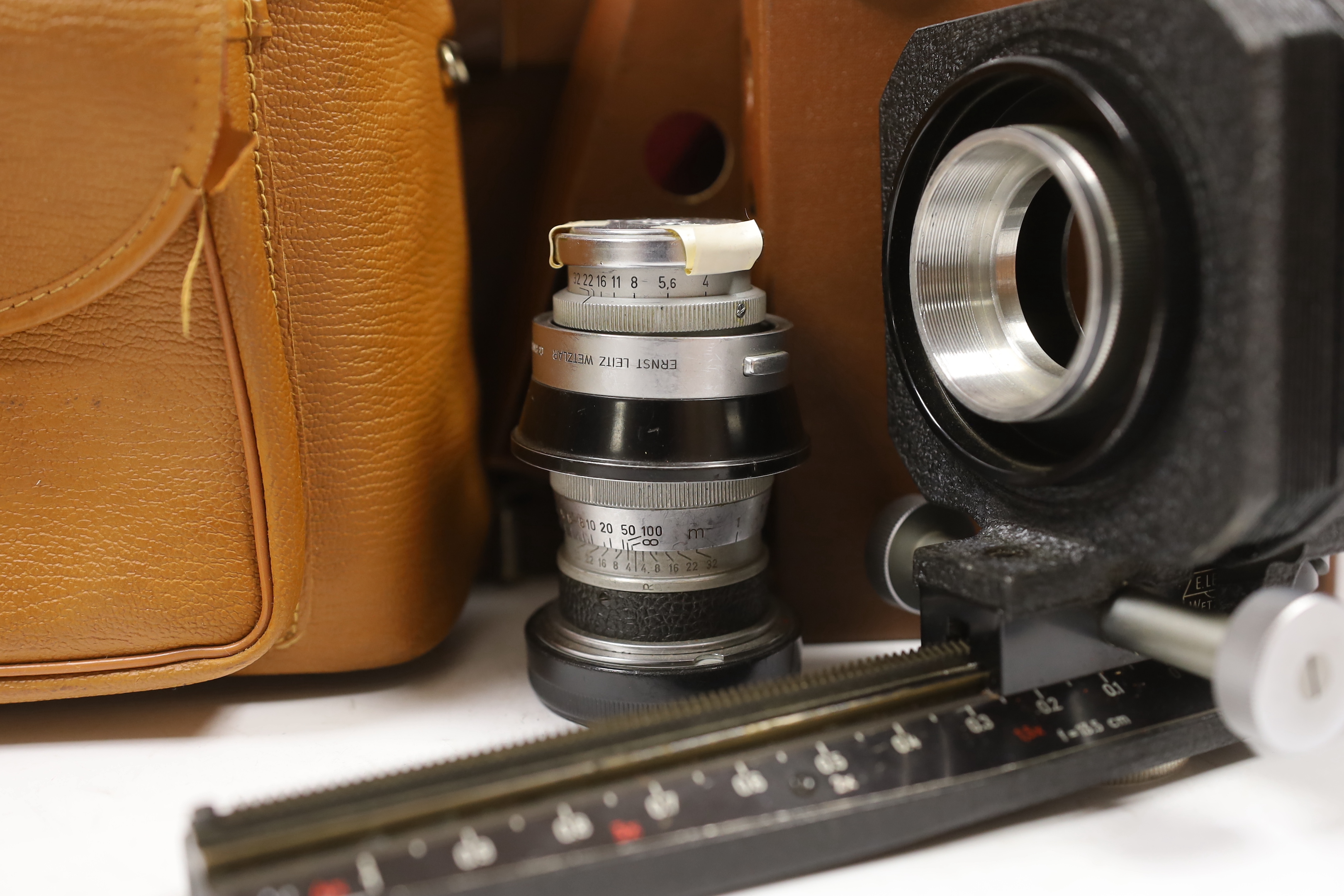 Leica accessories including; a Leitz Visoflex I and Visoflex II, a Summarit f-5cm 1:1.5 lens, an Elmar f=9cm 1:4lens, a Super Angulon 1:4/21 lens, a Range Finder, a Leitz Telyt f=20cm 1:4.5 lens, a Leitz Telyt SFT00 view